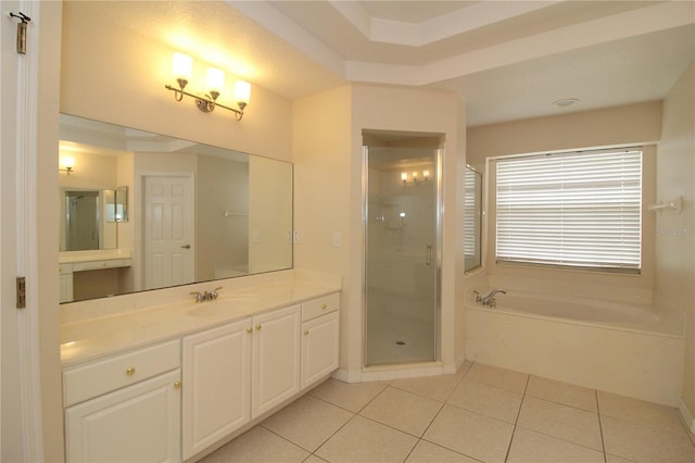 bathroom with tile patterned flooring, vanity, and independent shower and bath