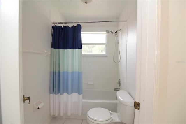 full bath featuring toilet, tile patterned flooring, and shower / tub combo with curtain