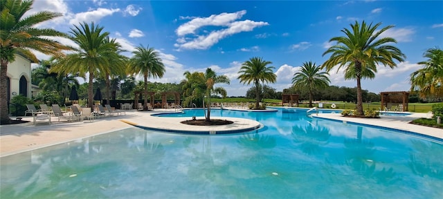 view of swimming pool featuring a pergola and a patio