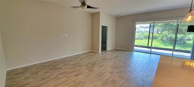 spare room with ceiling fan and light hardwood / wood-style floors