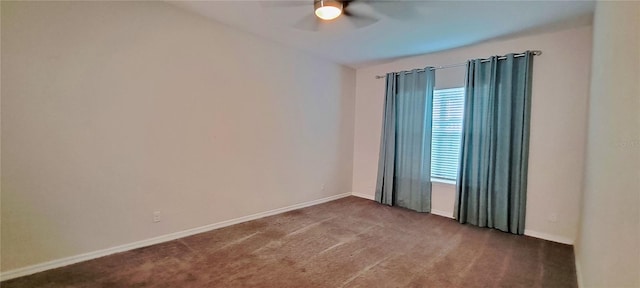 unfurnished room featuring ceiling fan and dark colored carpet