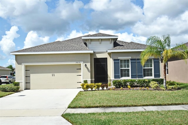 view of front of house with stucco siding, driveway, a front lawn, roof with shingles, and an attached garage