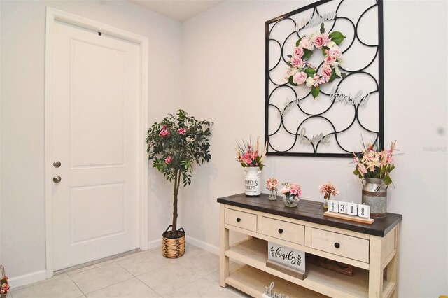 entrance foyer with light tile patterned floors