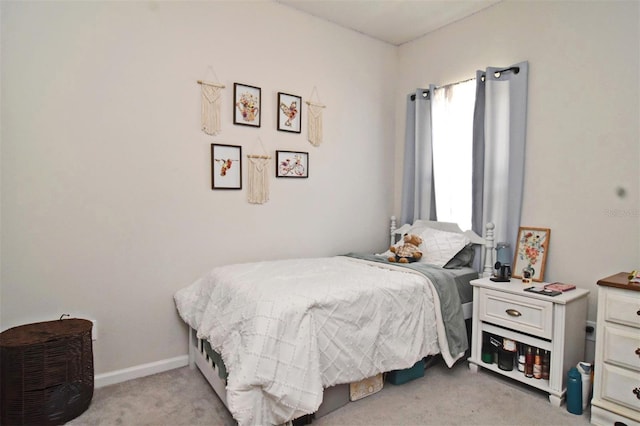 bedroom with light carpet