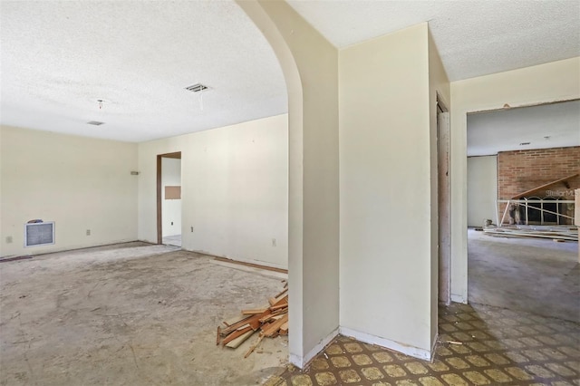 empty room with a textured ceiling