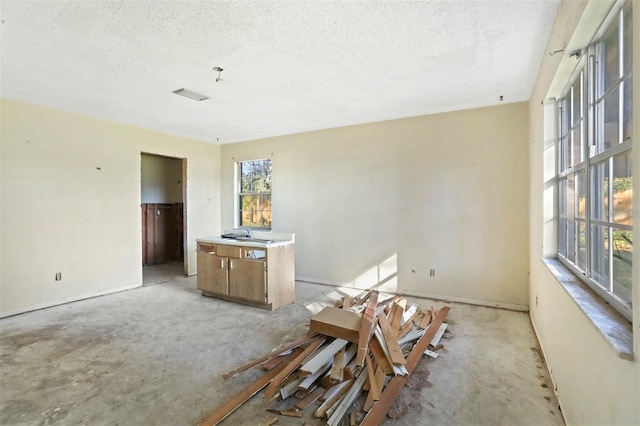 interior space featuring a textured ceiling