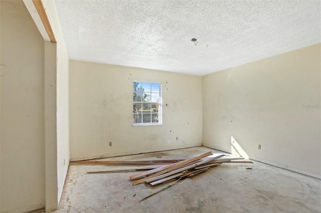 spare room featuring a textured ceiling