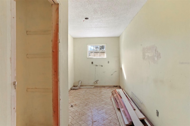 interior space with a textured ceiling