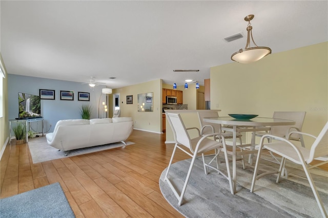 dining space featuring light hardwood / wood-style flooring