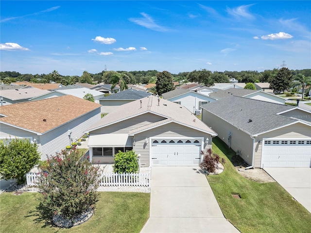 view of front of home featuring a front lawn and a garage