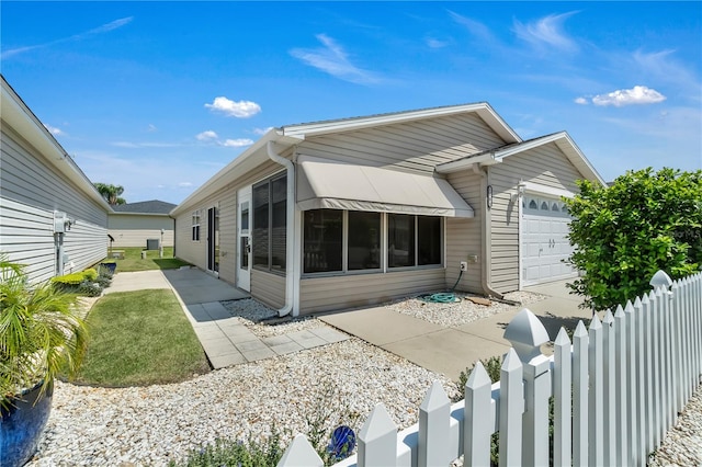 back of property featuring a garage