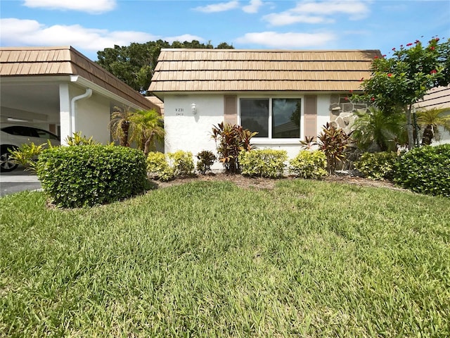 view of side of property featuring a yard