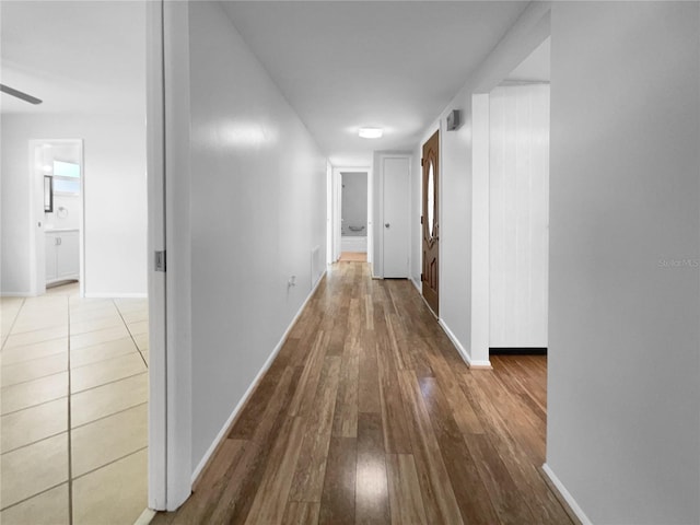 corridor featuring hardwood / wood-style flooring