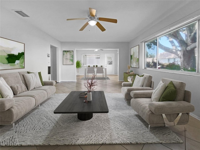 living room with ceiling fan and light tile patterned floors