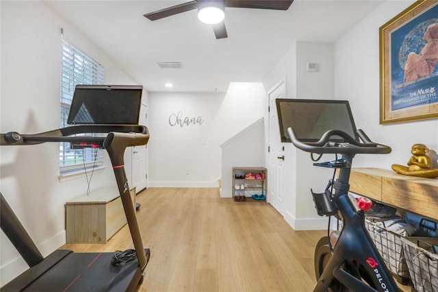 workout area featuring ceiling fan and light wood-type flooring