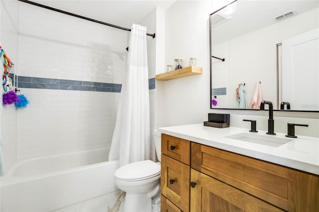 full bathroom with tile patterned floors, vanity, shower / tub combo, and toilet