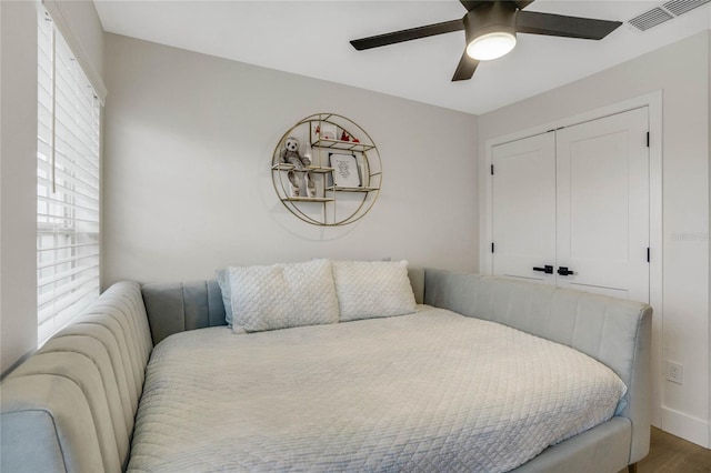 bedroom featuring a closet, ceiling fan, and hardwood / wood-style flooring