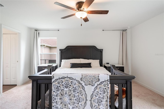 carpeted bedroom with ceiling fan