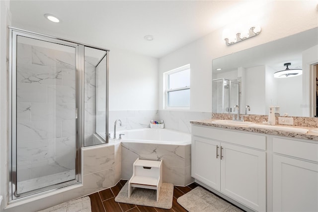 bathroom featuring separate shower and tub, vanity, and tile patterned floors