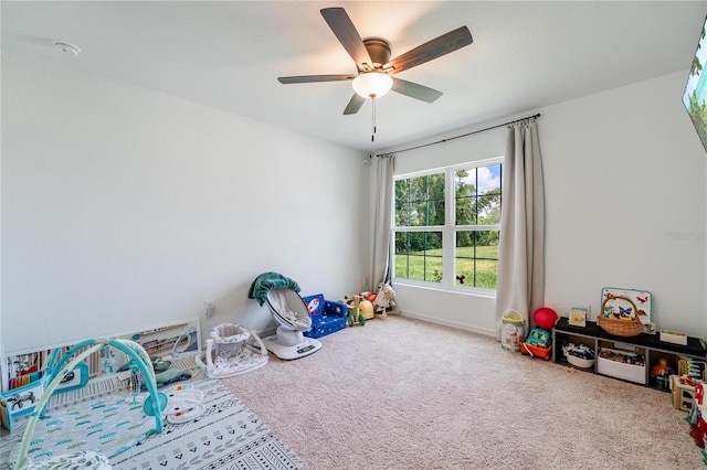 game room with carpet and ceiling fan