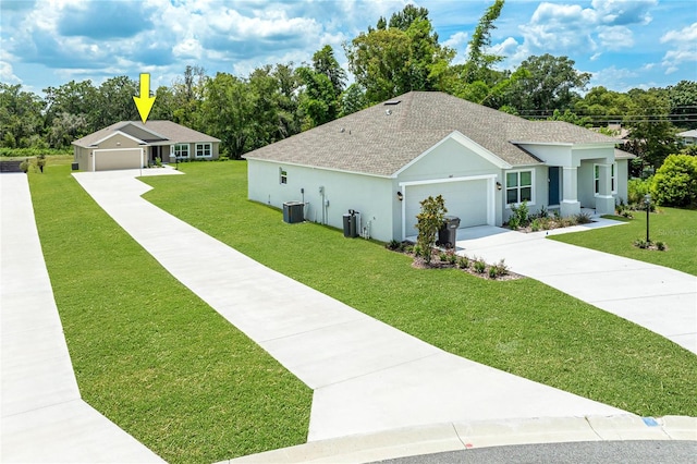 view of front of house with a garage and a front yard