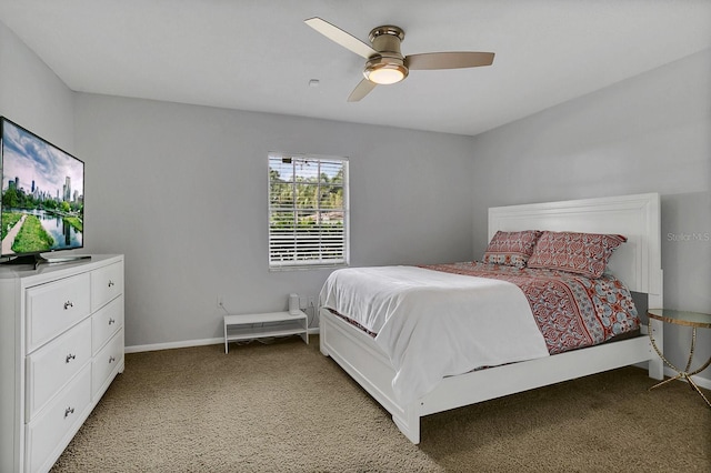 bedroom featuring light carpet, ceiling fan, and baseboards