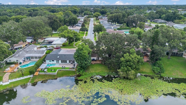 birds eye view of property with a water view and a residential view