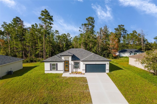 prairie-style home featuring concrete driveway, a front lawn, and an attached garage