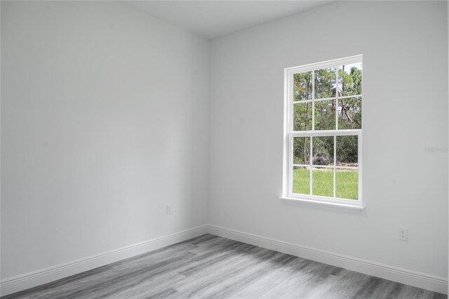 empty room featuring wood-type flooring