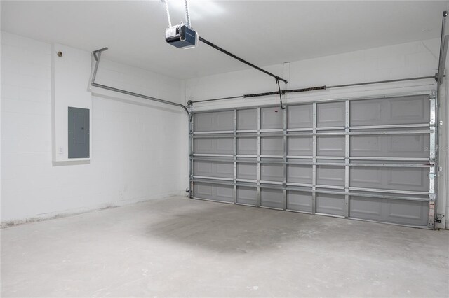 garage featuring a garage door opener and electric panel