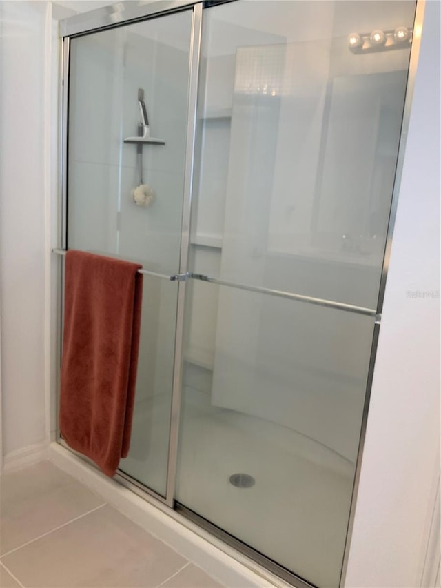 5639 Costa Blanca Way, Davenport, FL 33897 - full bathroom featuring tile patterned flooring and a shower stall