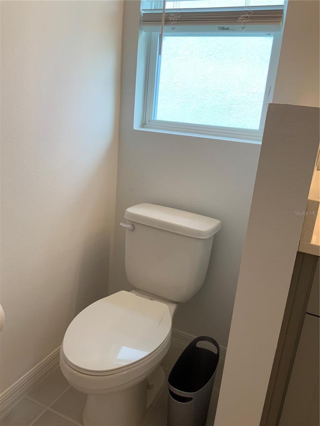 5639 Costa Blanca Way, Davenport, FL 33897 - bathroom featuring toilet, tile patterned floors, baseboards, and vanity
