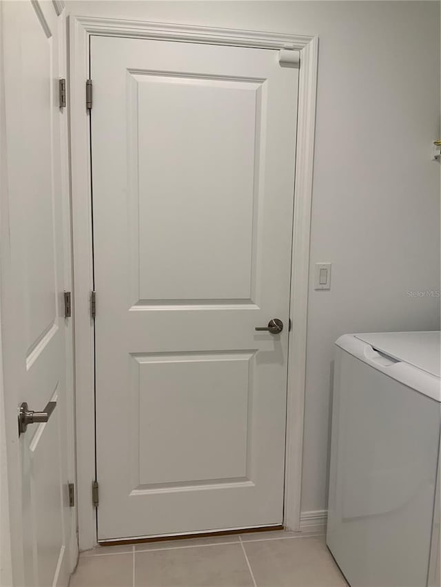 5639 Costa Blanca Way, Davenport, FL 33897 - laundry room featuring washer / clothes dryer and light tile patterned floors