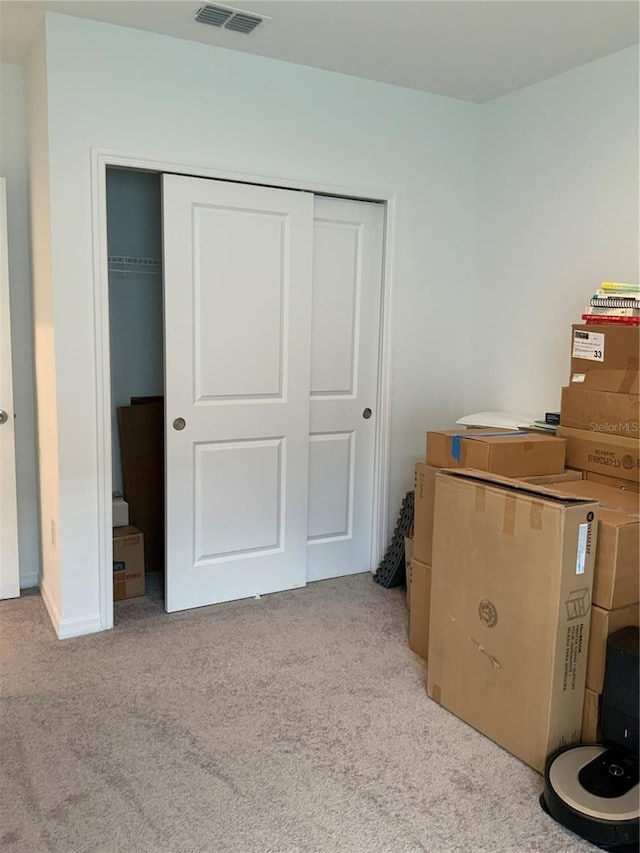 5639 Costa Blanca Way, Davenport, FL 33897 - bedroom with light carpet, a closet, and baseboards