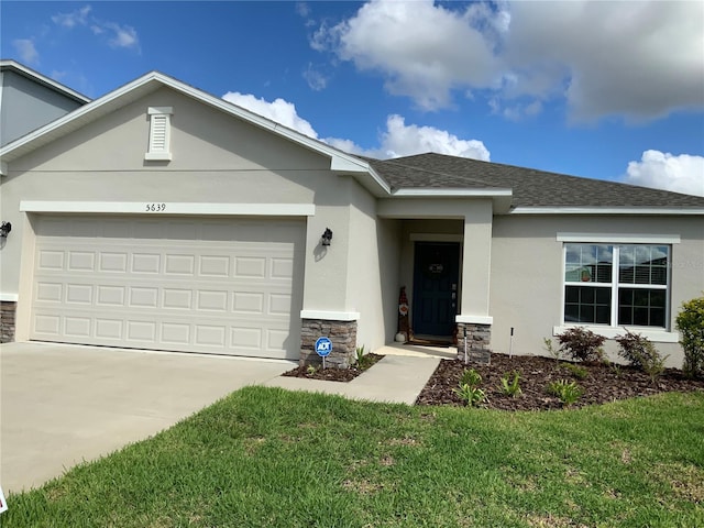 5639 Costa Blanca Way, Davenport, FL 33897 - ranch-style home with stone siding, a garage, concrete driveway, and stucco siding