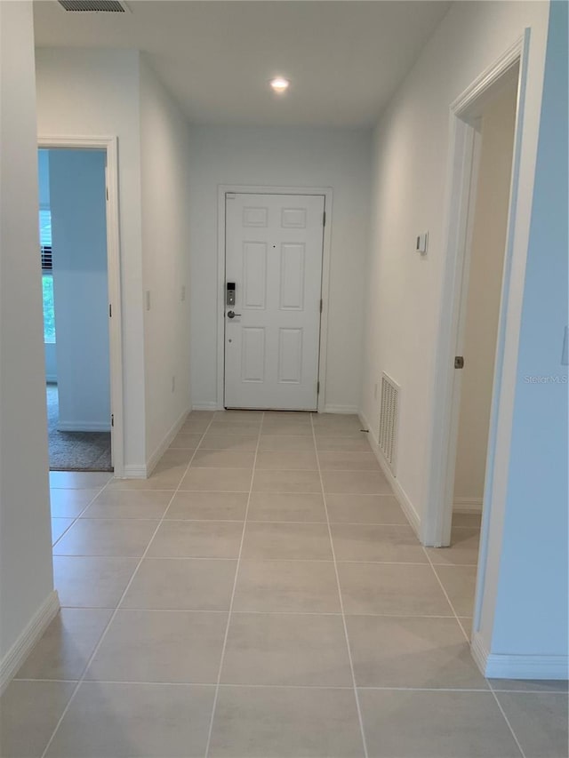 5639 Costa Blanca Way, Davenport, FL 33897 - hallway featuring light tile patterned floors, recessed lighting, and baseboards