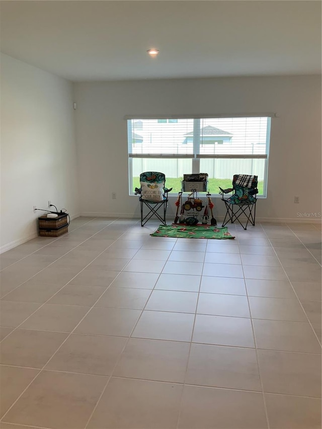 5639 Costa Blanca Way, Davenport, FL 33897 - living area featuring tile patterned flooring, healthy amount of natural light, recessed lighting, and baseboards