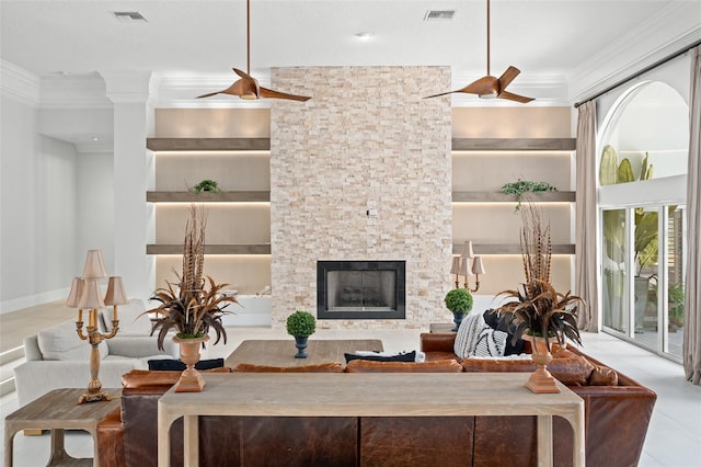 living room with built in shelves, a fireplace, a textured ceiling, light tile patterned floors, and ceiling fan