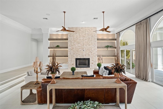 tiled living room featuring ceiling fan, a fireplace, a textured ceiling, and built in shelves