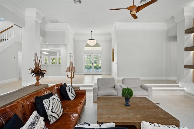 living room featuring ceiling fan with notable chandelier, french doors, and crown molding