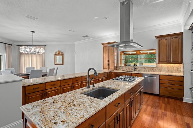 kitchen featuring dark wood finished floors, appliances with stainless steel finishes, brown cabinetry, a sink, and island range hood