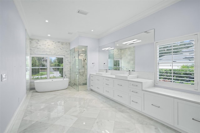 bathroom featuring tile patterned flooring, independent shower and bath, a healthy amount of sunlight, and vanity