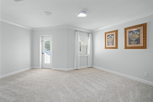 carpeted spare room featuring a textured ceiling and crown molding