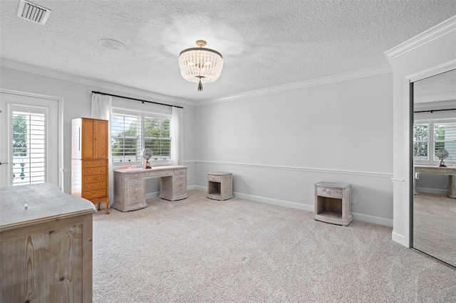 unfurnished office with a wealth of natural light, a textured ceiling, crown molding, and light colored carpet