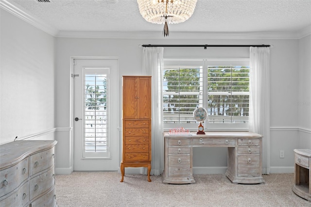 carpeted office with a textured ceiling, ornamental molding, and an inviting chandelier