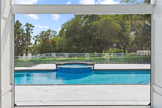 view of pool featuring an in ground hot tub and a patio area