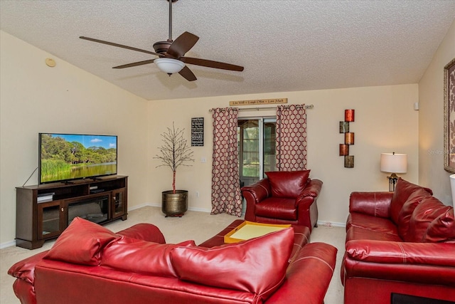 carpeted living room with a textured ceiling, ceiling fan, and vaulted ceiling