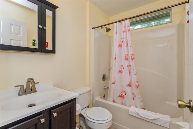 full bathroom featuring vanity, shower / bathtub combination with curtain, and toilet