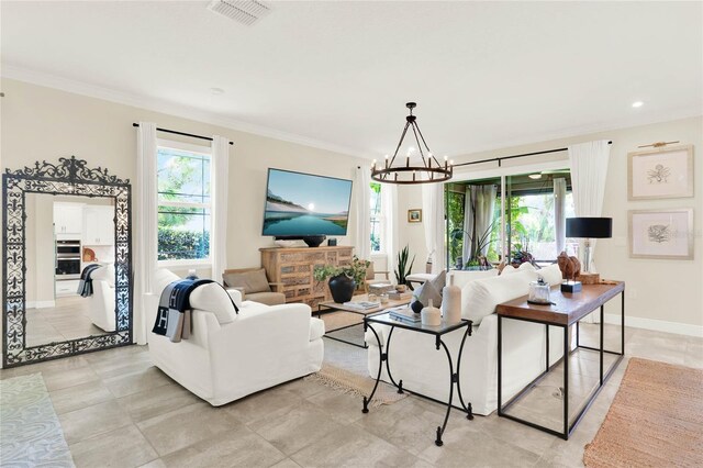 living room featuring plenty of natural light, visible vents, and ornamental molding