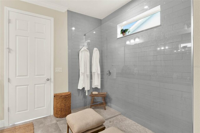 full bath with ornamental molding and walk in shower